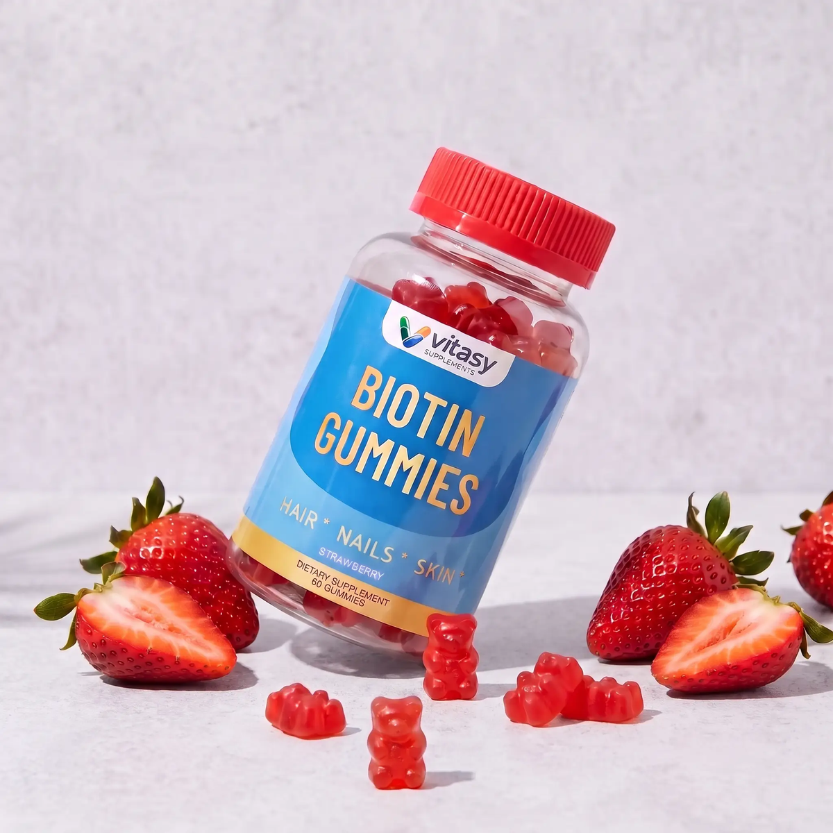 Biotin Gummies v4 - Gallery Image 8 - Strawberry bottle/fruit/six-bear still-life