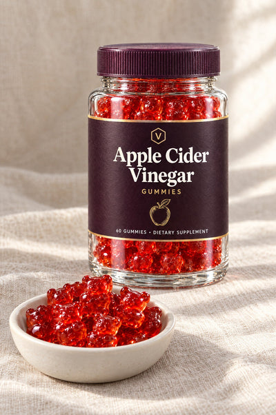 Red gummies in a dish in front of the jar