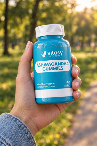 Holding Vitasy Ashwagandha Gummies outdoors