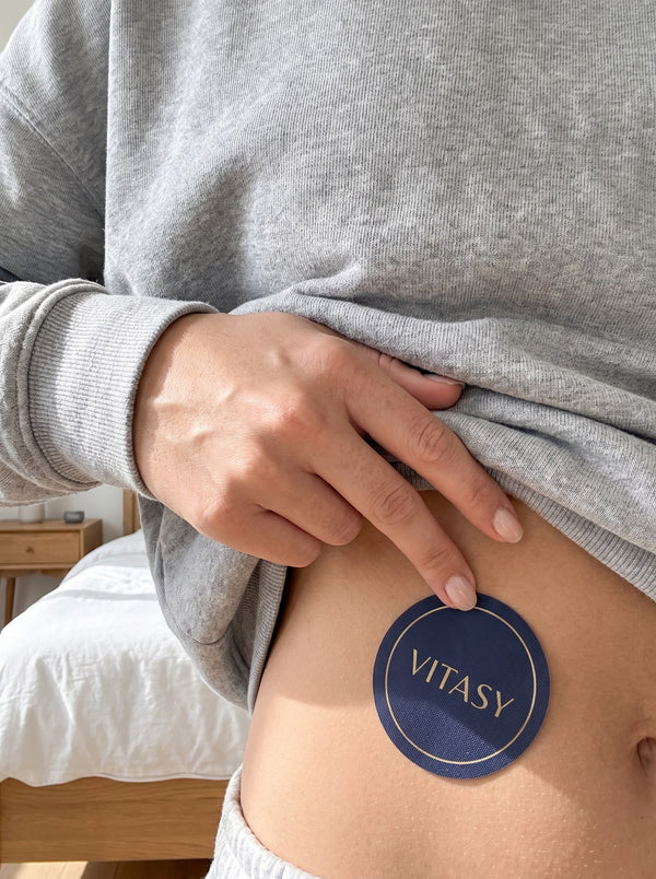 Applying a patch to the lower abdomen