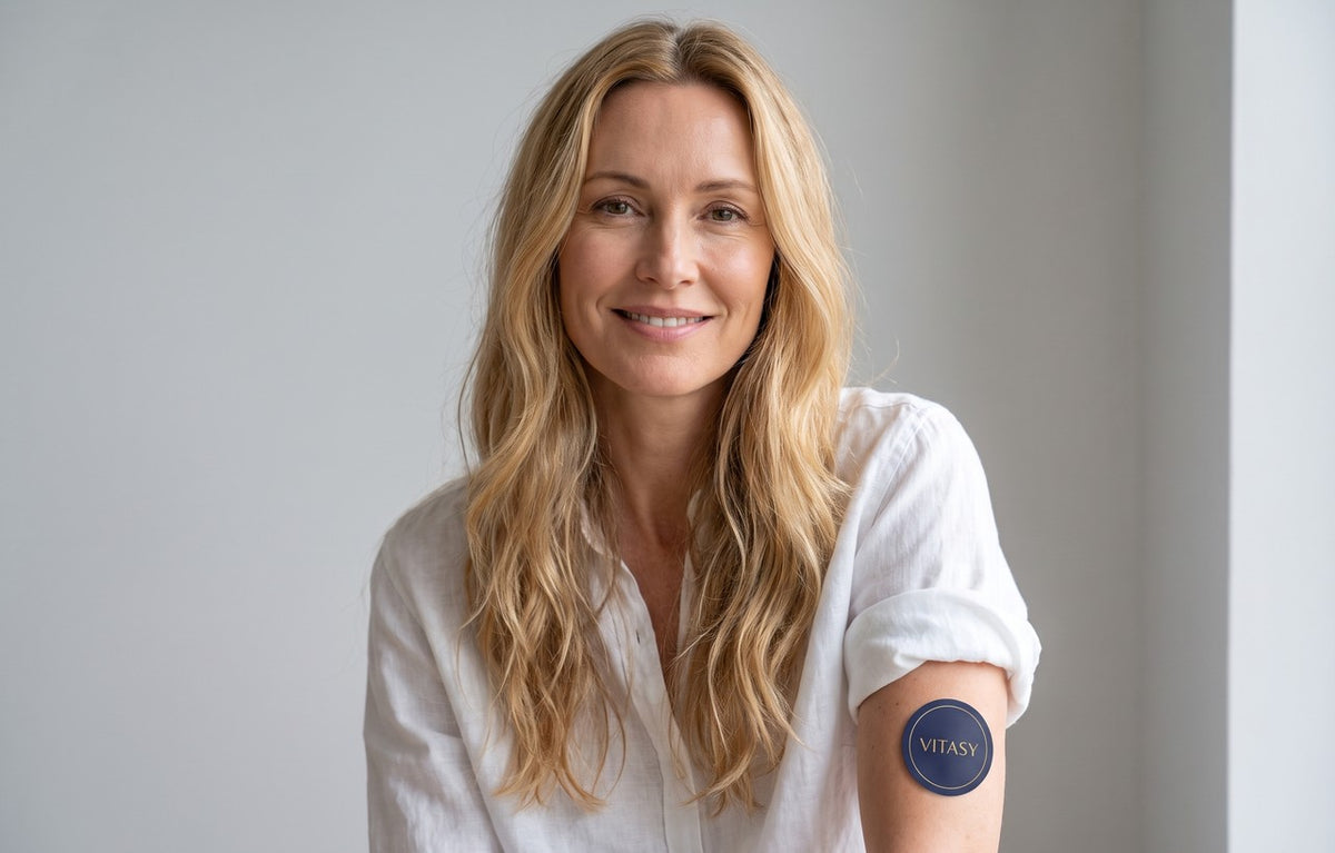 Woman with a Vitasy patch on her upper arm