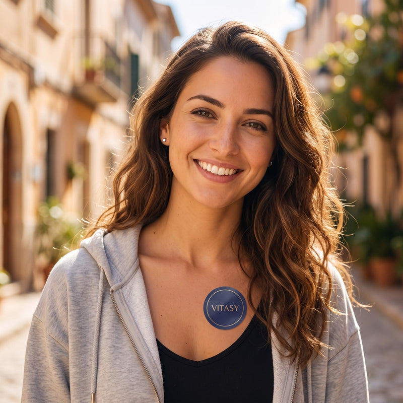 Woman wearing a Vitasy patch below her collarbone