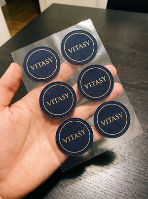Sheet of round navy Vitasy patches