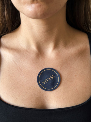 Vitasy patch on a collarbone