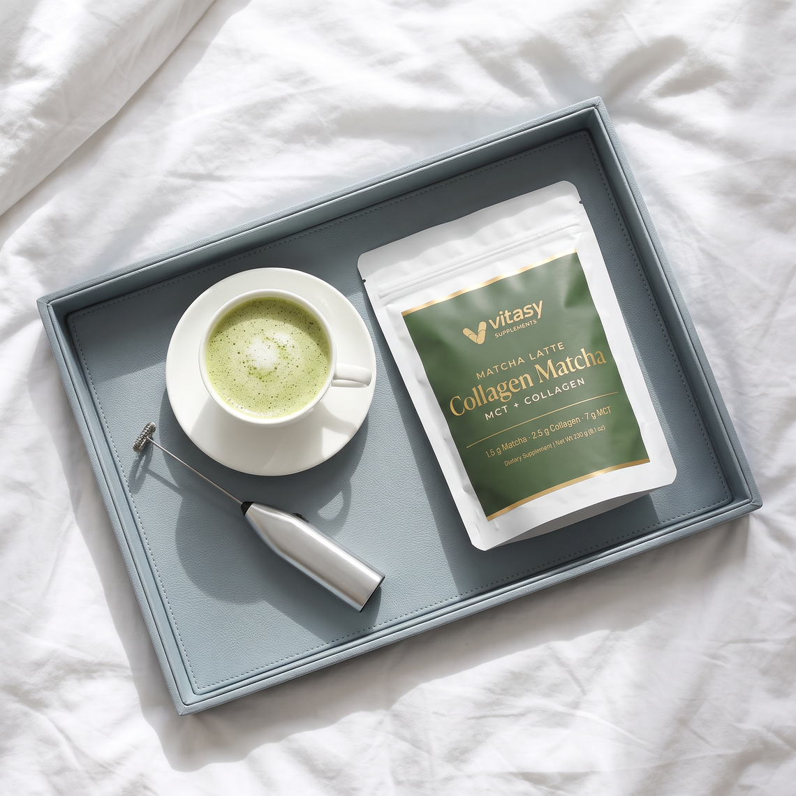 Vitasy Collagen Matcha pouch on a tray with a matcha latte