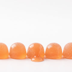 Row of peach-flavored gummies