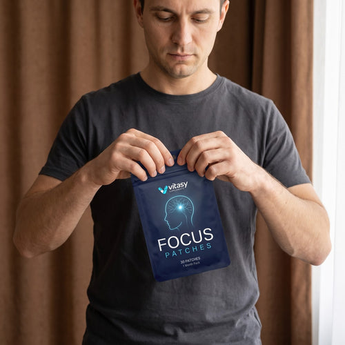 Man opening a Vitasy Focus Patches pouch