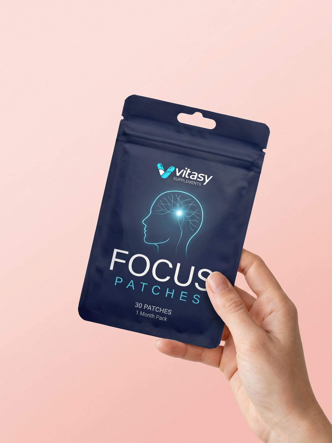 Hand holding a Vitasy Focus Patches pouch