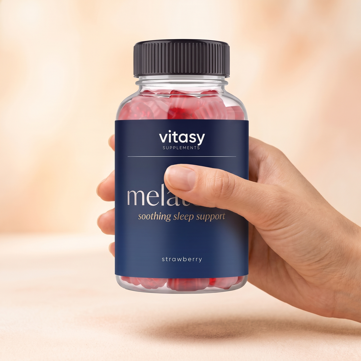 Melatonin Gummies v9 Strawberry hand holding bottle upright