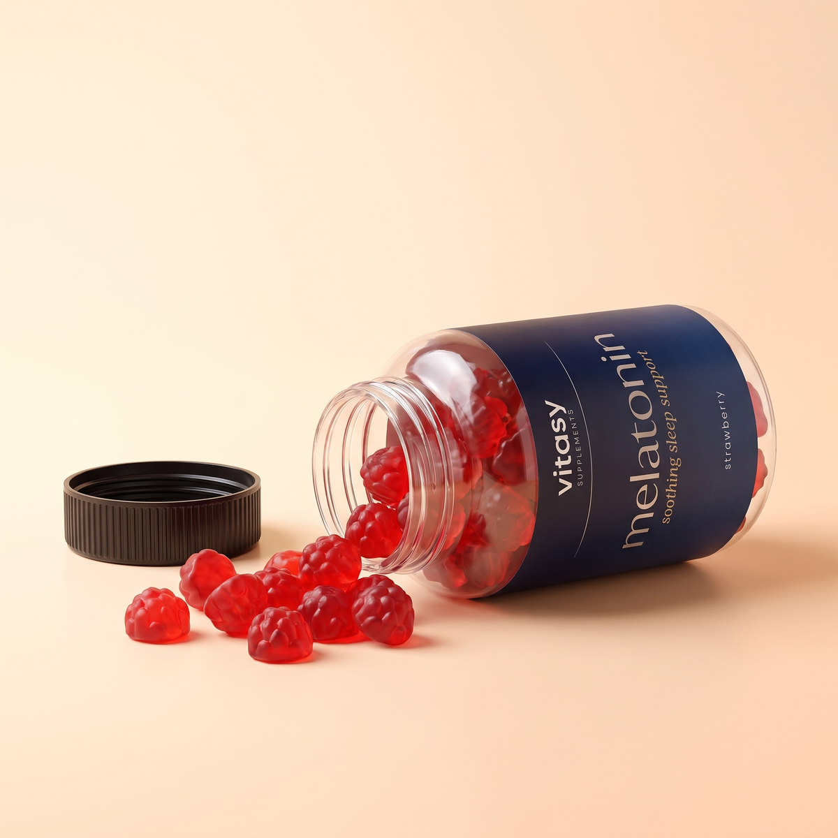 Melatonin Gummies v9 Strawberry spilled flatlay with raspberry gummies