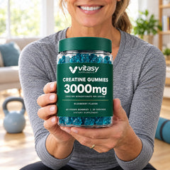 Woman holding a jar of Vitasy Creatine Gummies