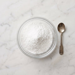 NAD+ powder in a small glass dish