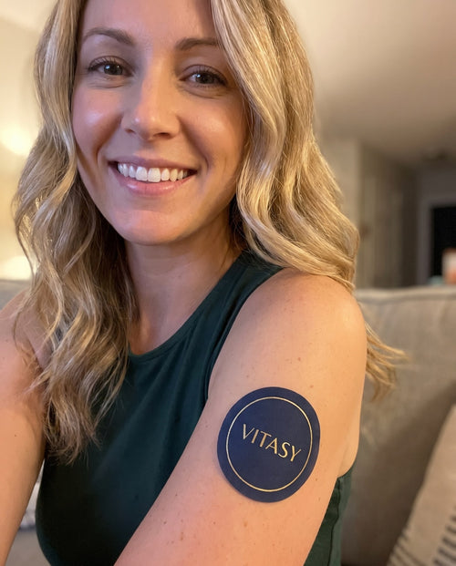 Women holding Vitasy NAD+ Patches pouches and patches