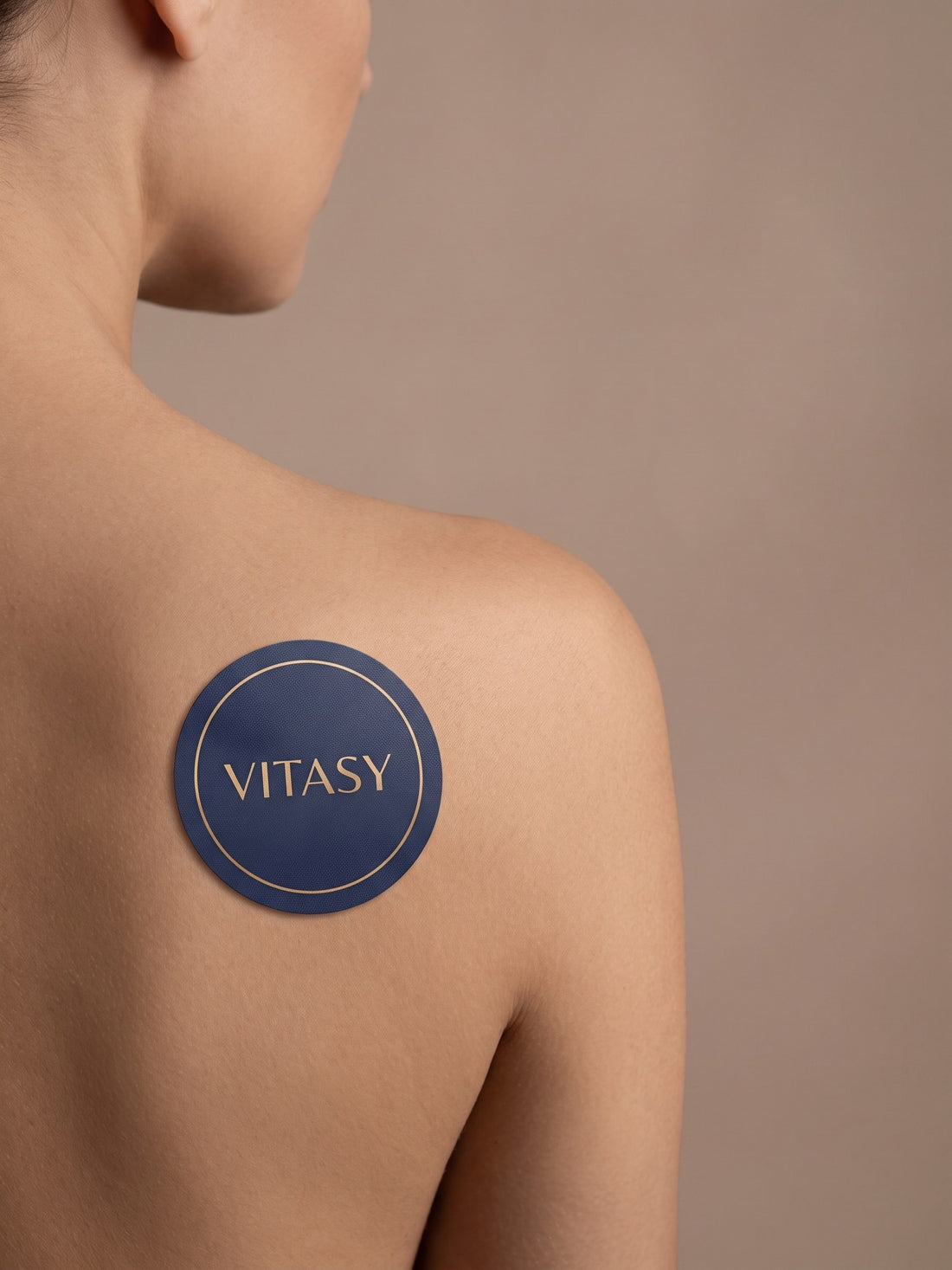 Vitasy patch on a shoulder