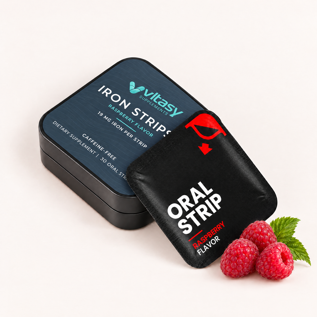 Vitasy Iron Strips tin and raspberry oral strip pouch with fresh raspberries