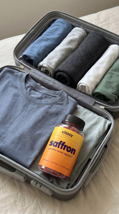 Vitasy Saffron Gummies packed in an open suitcase