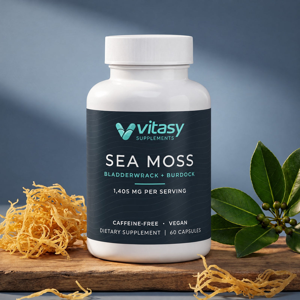 Vitasy Sea Moss Capsules bottle on a wooden surface with sea moss and green leaves