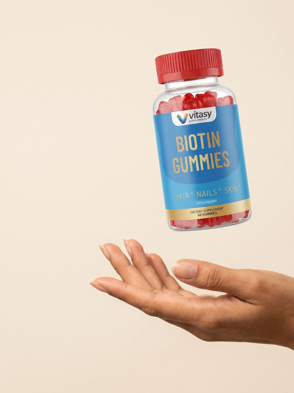 Vitasy Biotin Gummies bottle above an open hand