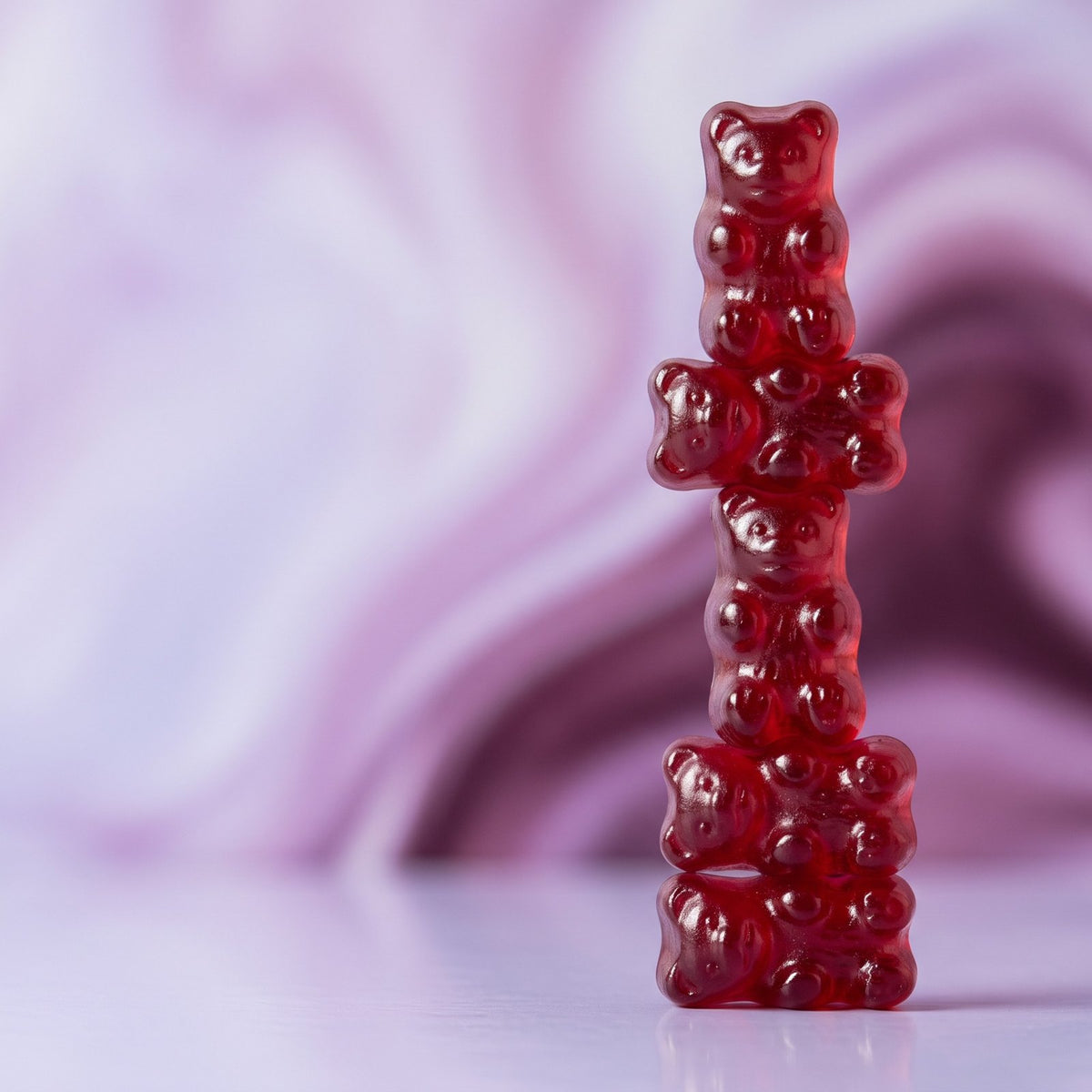 Stack of red apple cider vinegar gummy bears