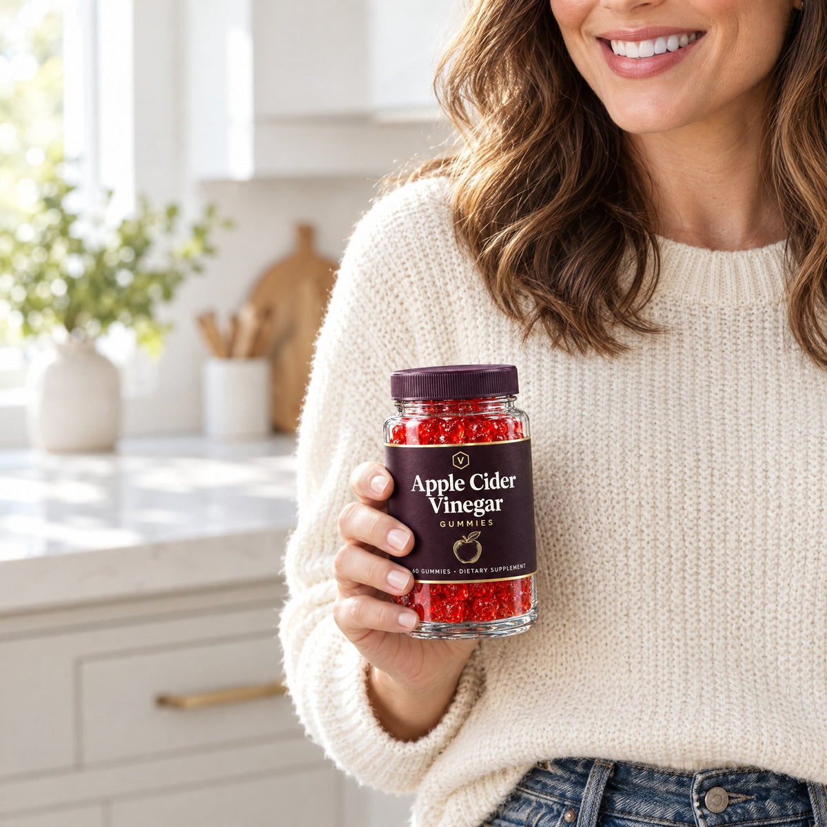 Woman in a kitchen holding a jar of Vitasy Apple Cider Vinegar Gummies