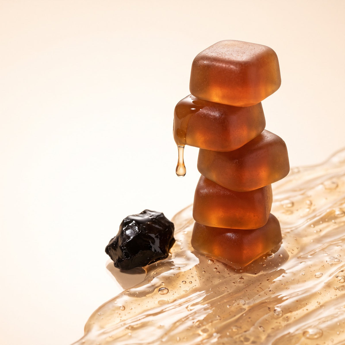 Stack of amber shilajit gummies