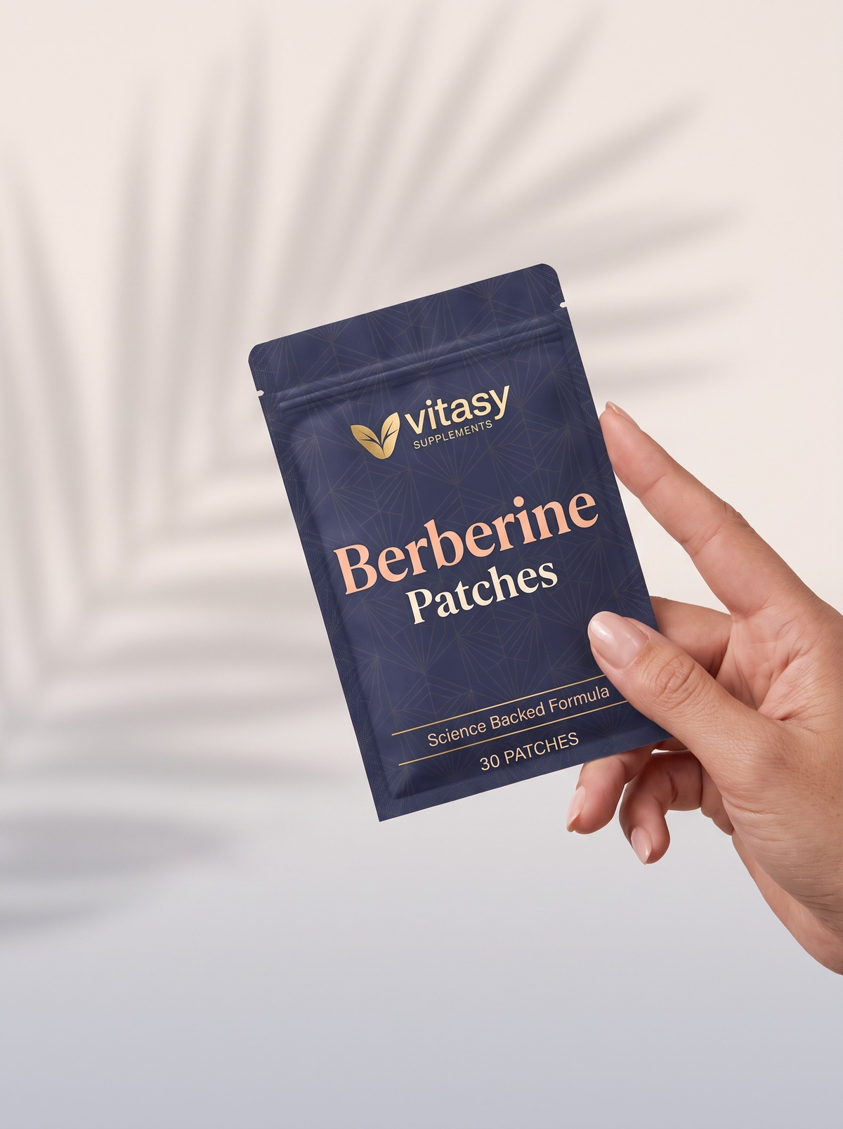 Hand holding a pouch of Vitasy Berberine Patches