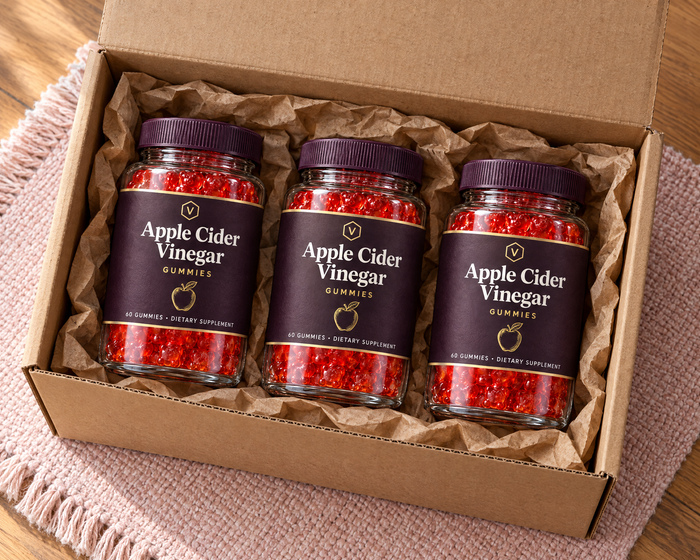 Three jars of Vitasy Apple Cider Vinegar Gummies in a shipping box
