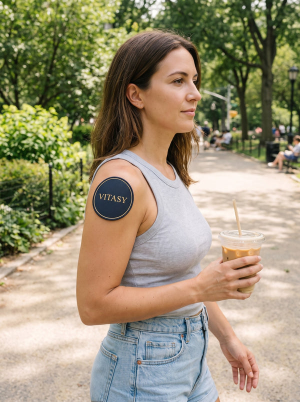 Woman walking in a park wearing a patch on her shoulder