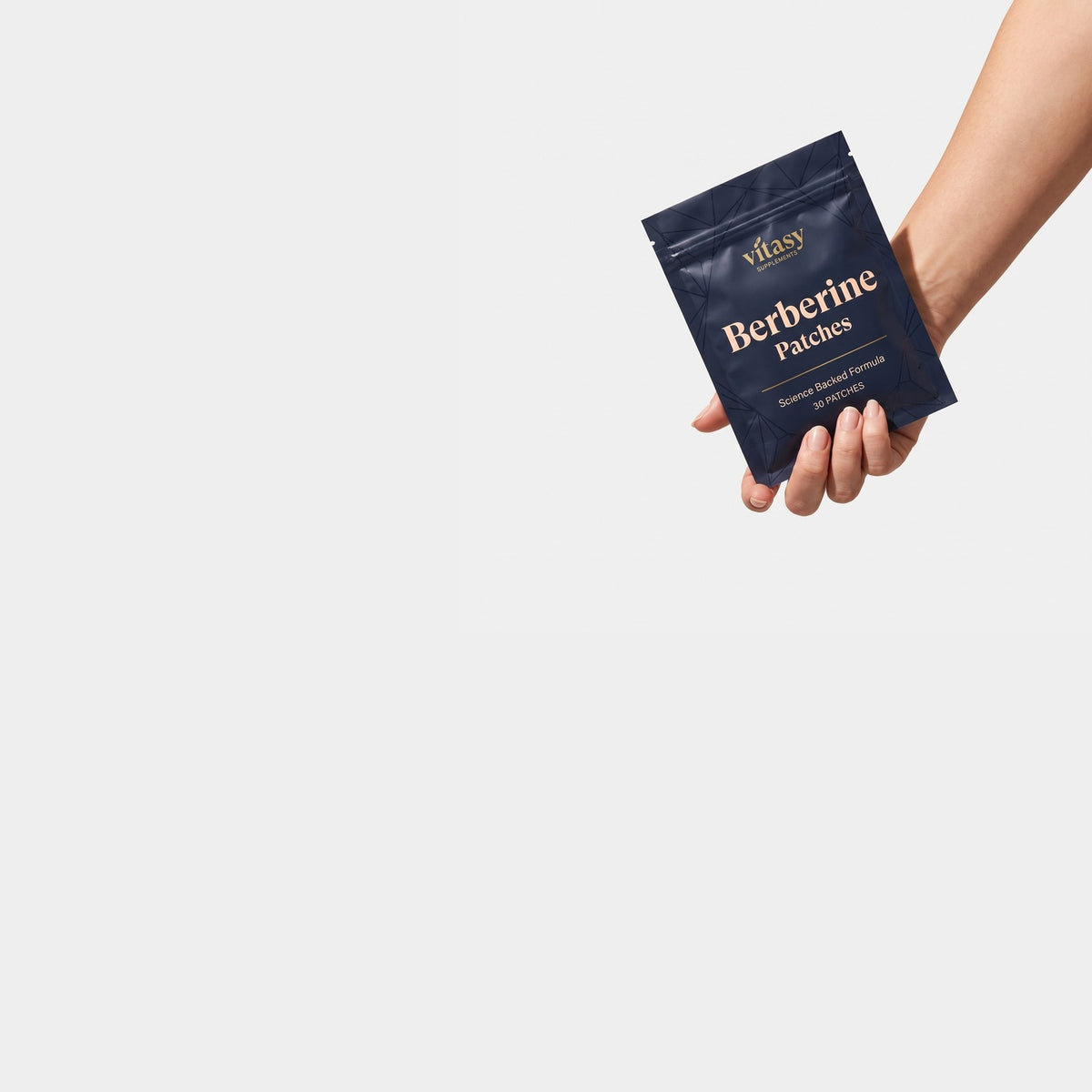 Hand holding a Vitasy Berberine Patches pouch