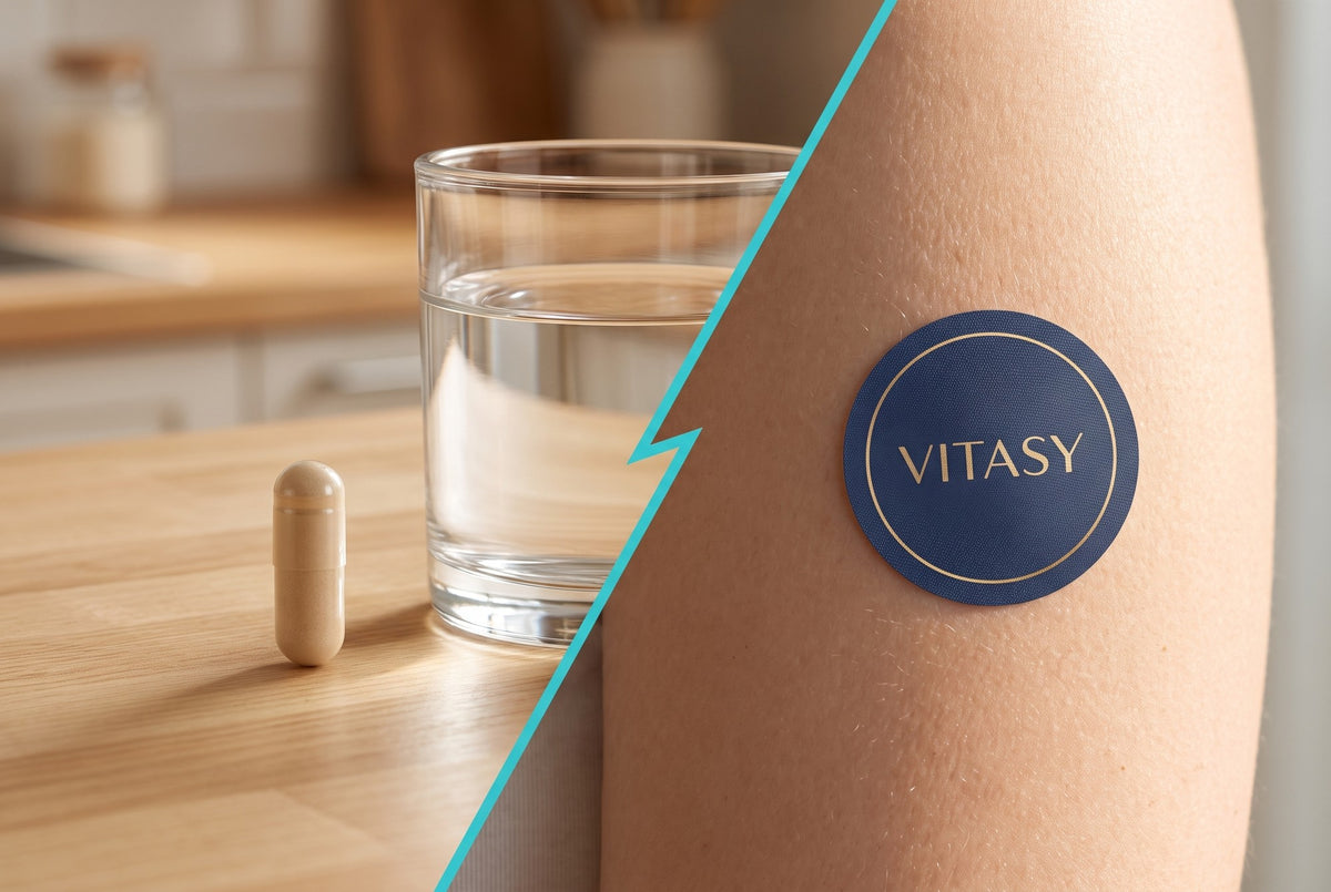 A capsule next to a glass of water and a Vitasy patch on an arm