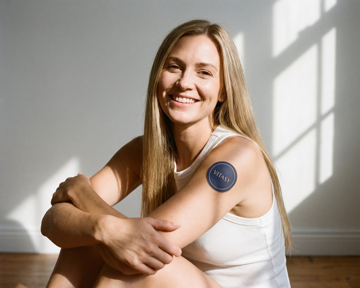 Relaxed woman with a Vitasy patch on her arm