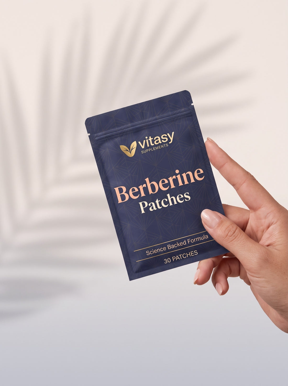 Hand holding a pouch of Vitasy Berberine Patches