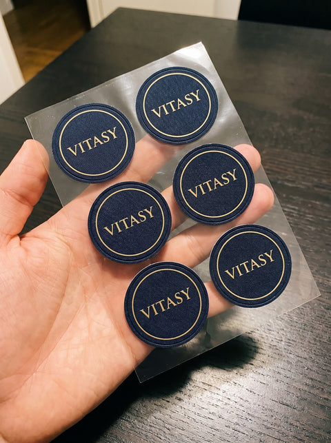 Sheet of Vitasy patches in a hand