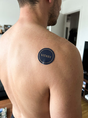 Vitasy patch on a shoulder