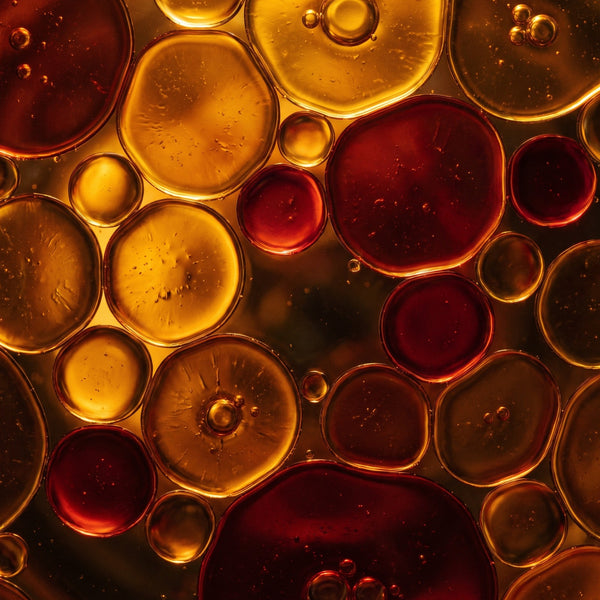 Close-up of amber oil droplets