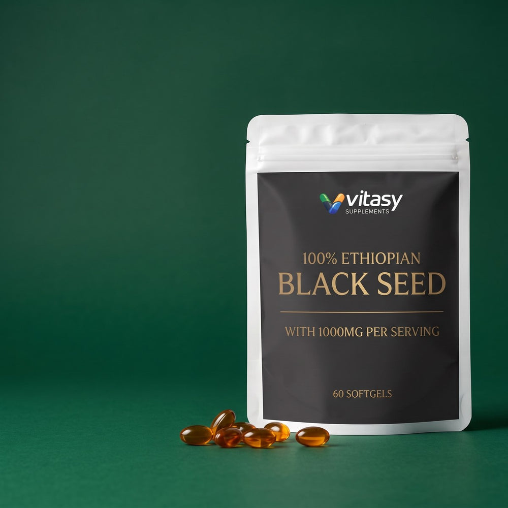 Vitasy Ethiopian Black Seed pouch with amber softgels on a green backdrop