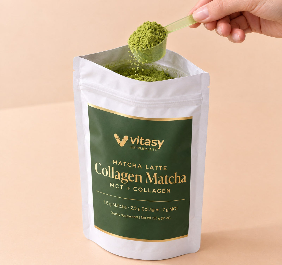 Scoop of matcha powder lifted from the open pouch