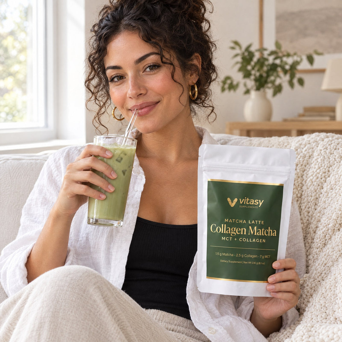 Woman with an iced matcha latte and the Vitasy Collagen Matcha pouch