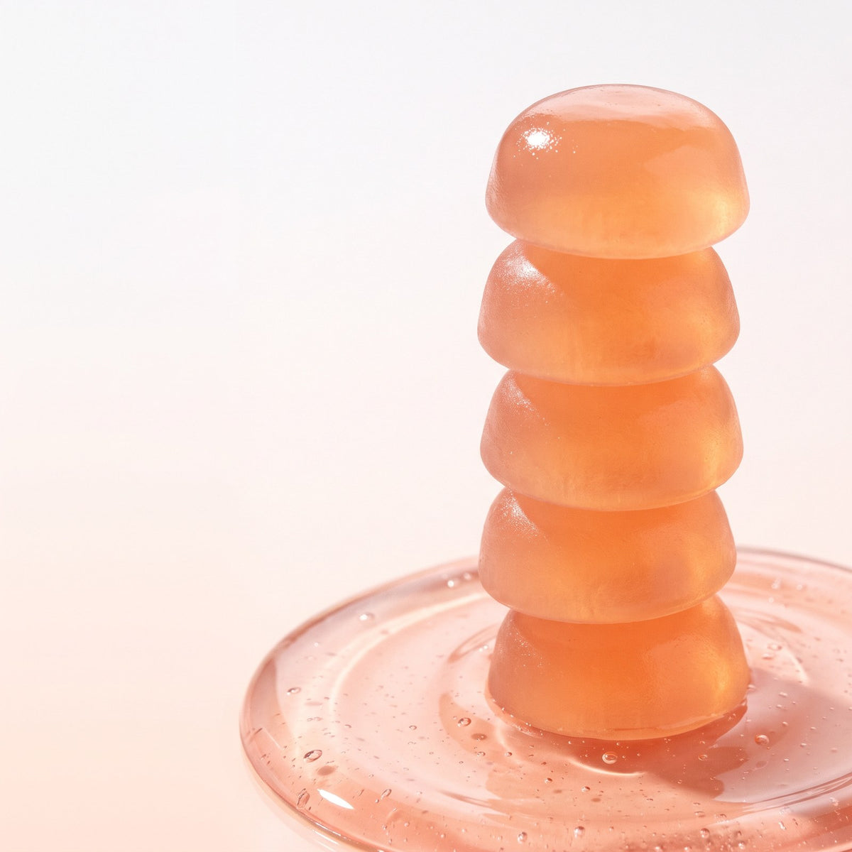 Stack of peach collagen gummies