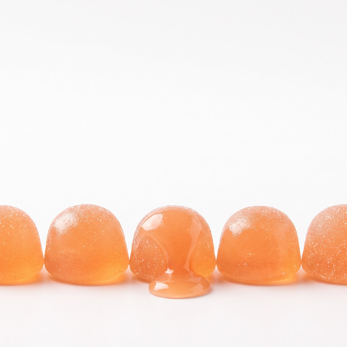 Row of peach-flavored gummies