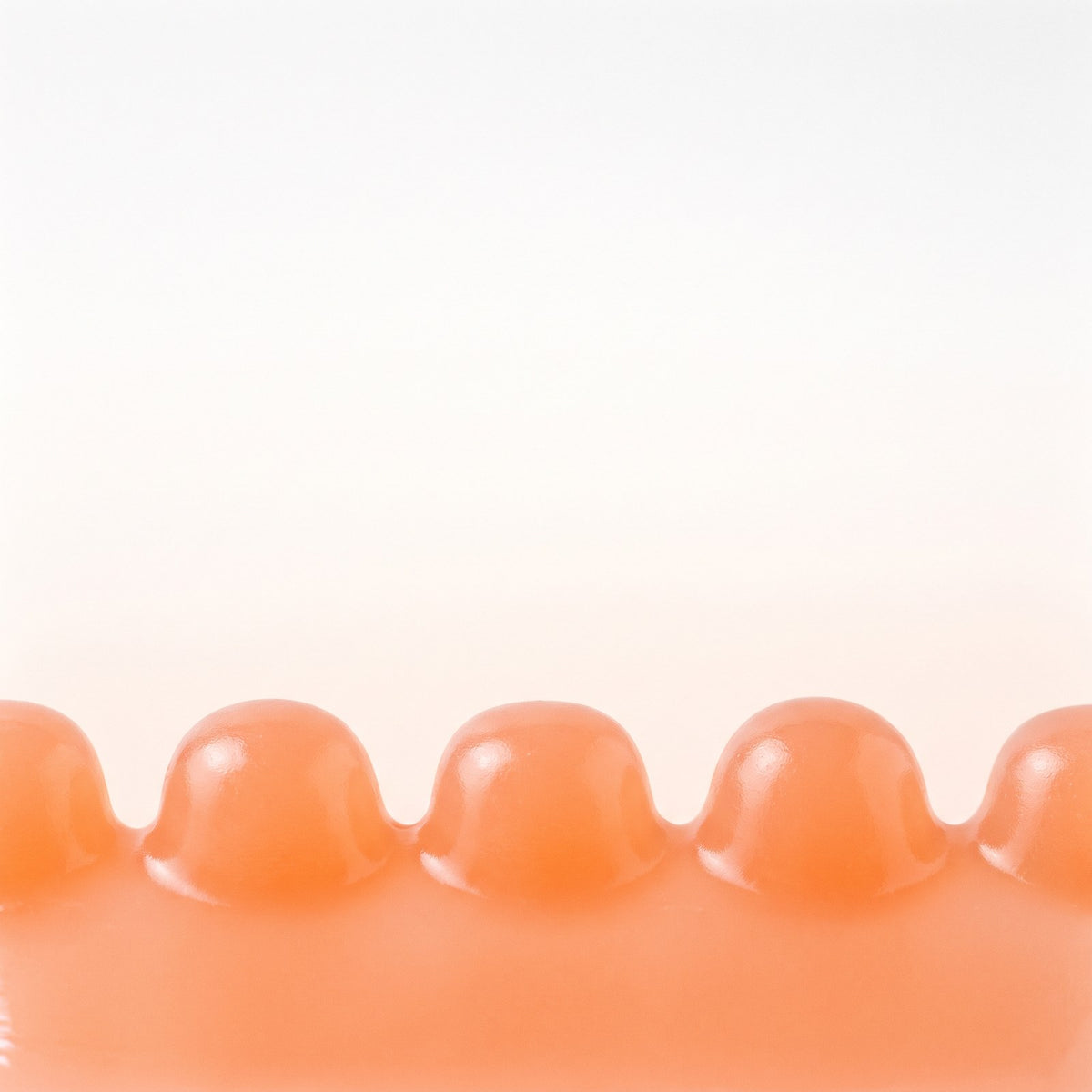 Peach gummies on a light background