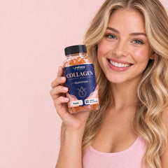 Woman smiling with a bottle of Vitasy Collagen Gummies