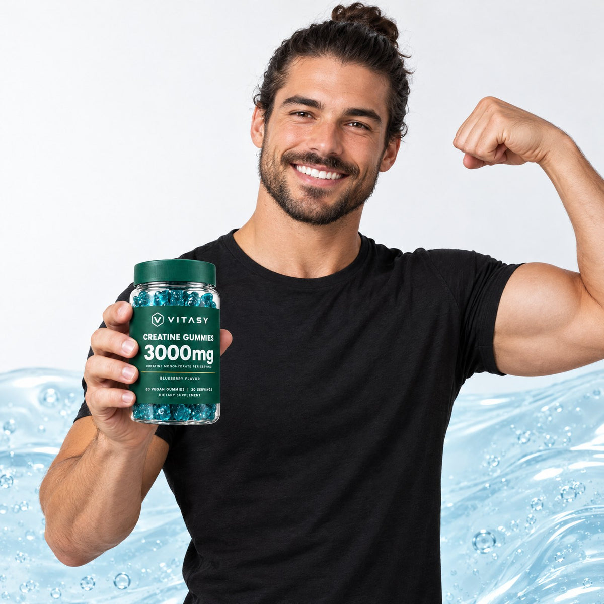 Smiling man holding a jar of Vitasy Creatine Gummies