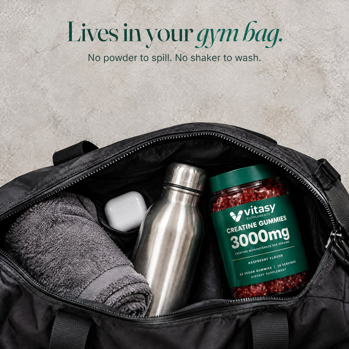 Vitasy Creatine Gummies jar in an open gym bag with a towel and water bottle