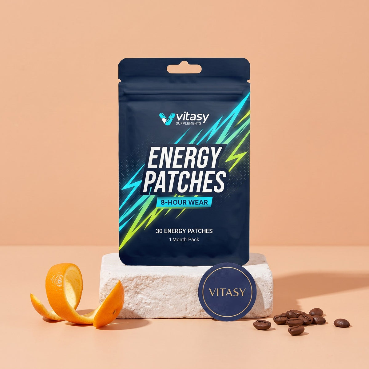 Vitasy Energy Patches pouch on a stone block with coffee beans and orange peel