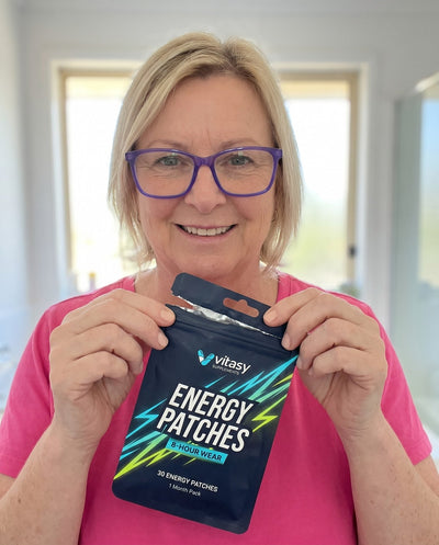 Holding a pouch of Energy Patches