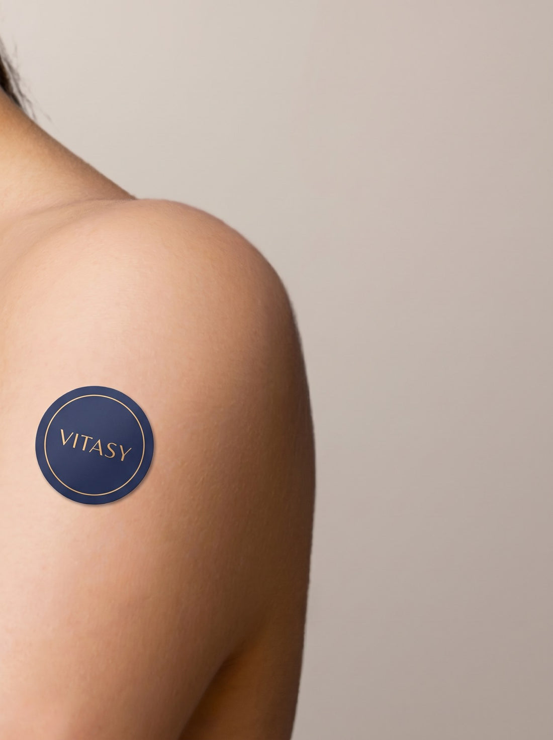 Vitasy energy patch worn on the shoulder