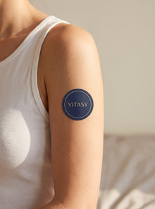 Close-up of a Vitasy energy patch on the upper arm