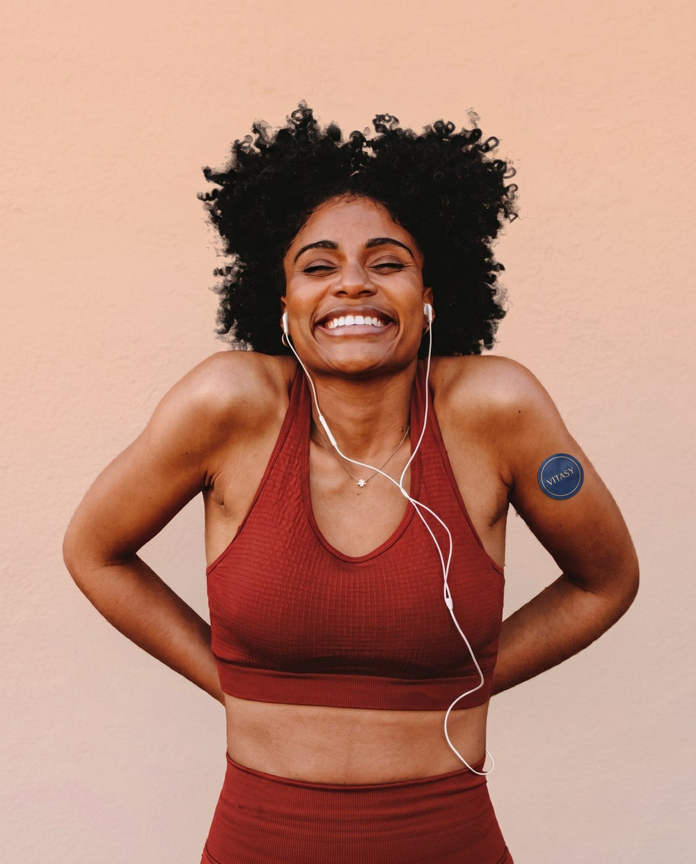 Woman wearing a Vitasy energy patch on her upper arm