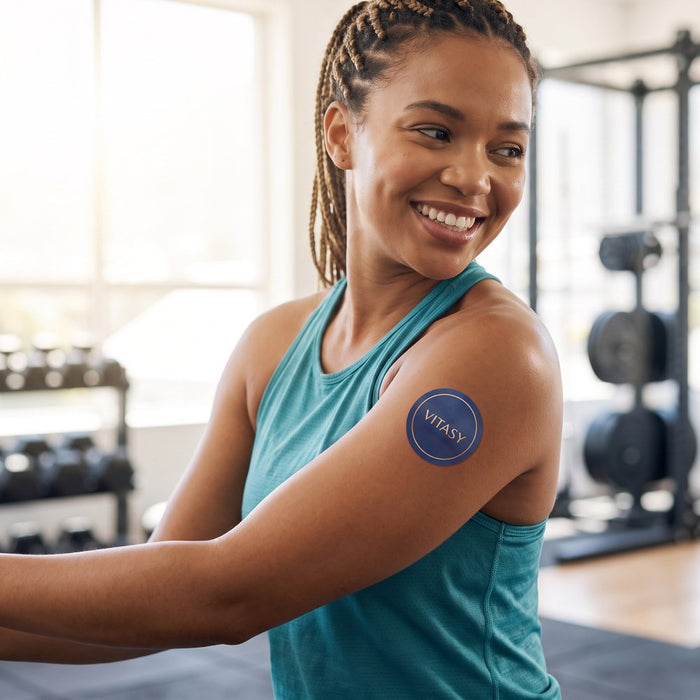 Woman at the gym wearing a Vitasy Energy Patch